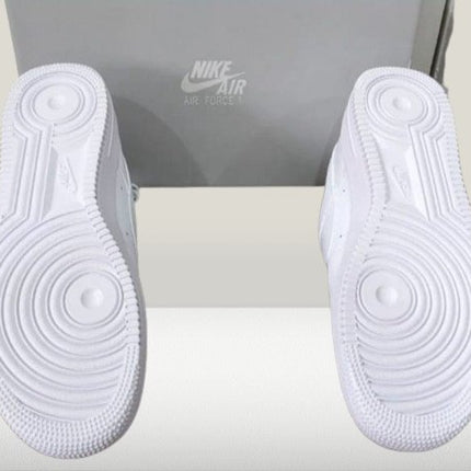 Back view of white Nike Air Force 1 sneakers