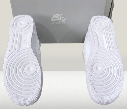 Back view of white Nike Air Force 1 sneakers