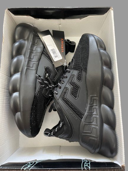 Package of Studio view of Versace Chain Reaction Black Shoes